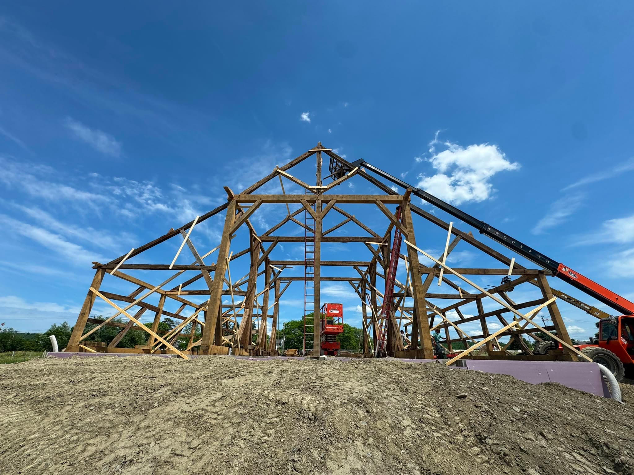 The raised timber frame of the 1487 barn, rebuilt on Seneca Lake.